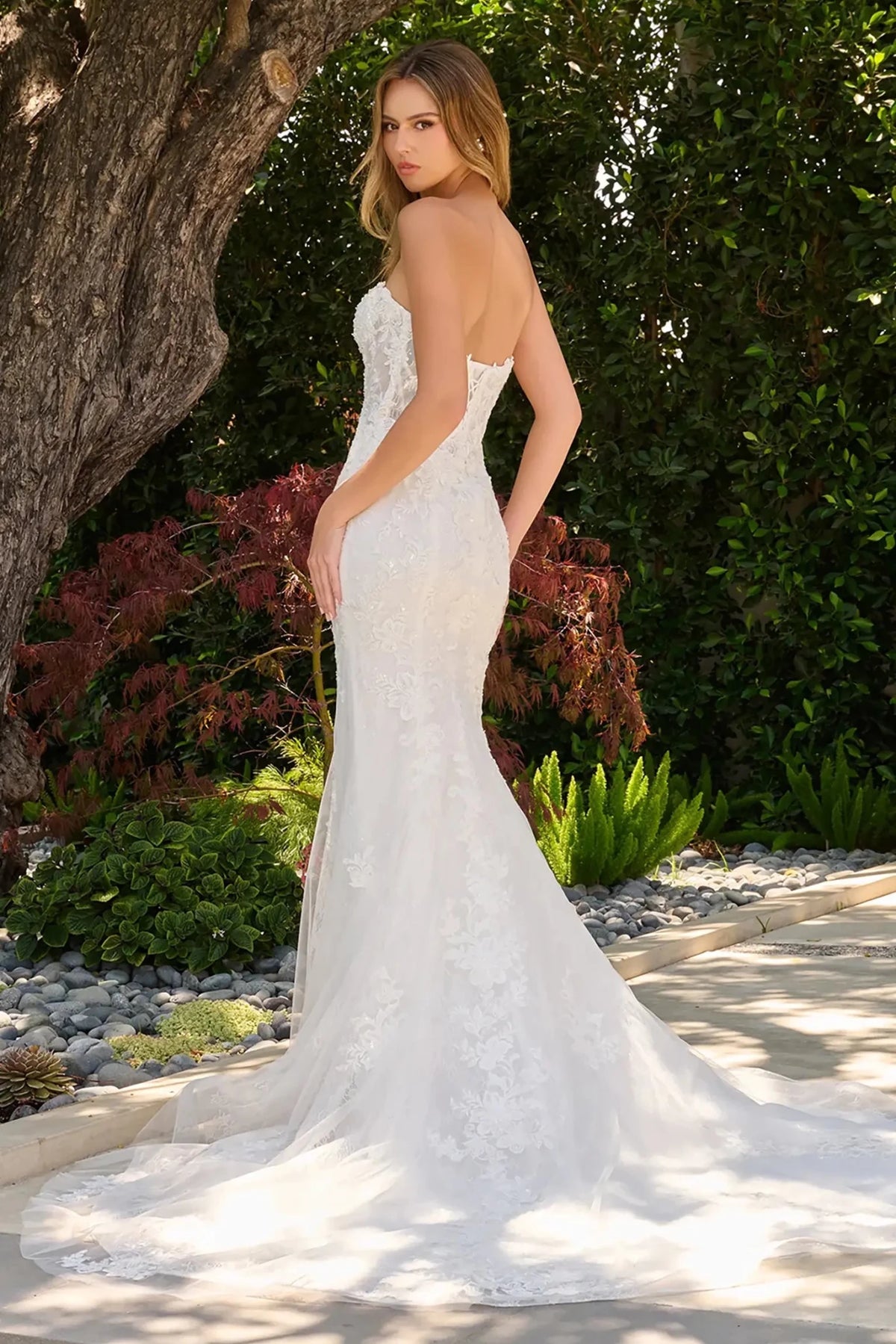 Off-white wedding dress featuring lace back up corset bodice with beads, sequins and embroidery