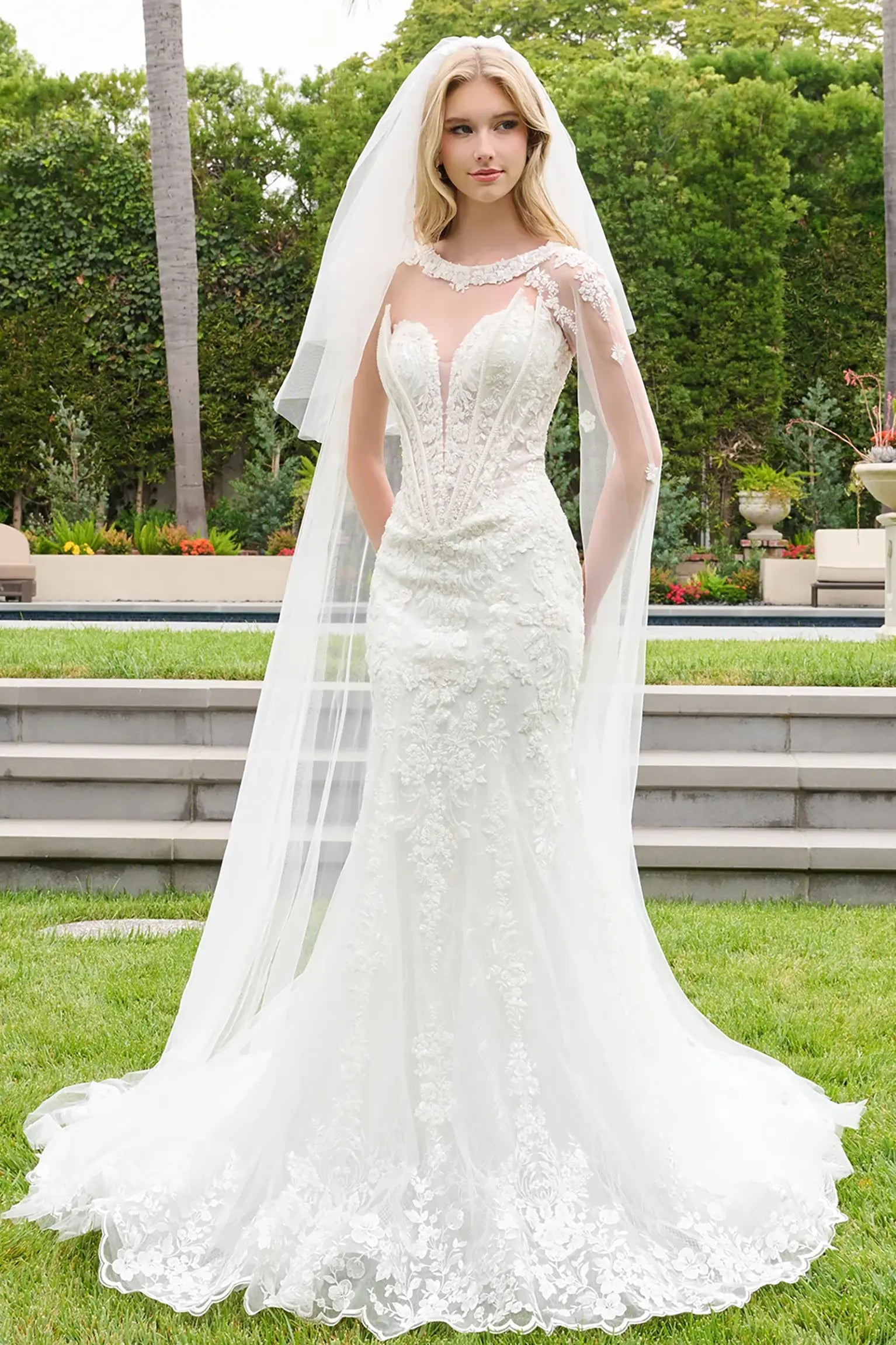 Off-white wedding dress with strapless corset bodice and layered side flaps