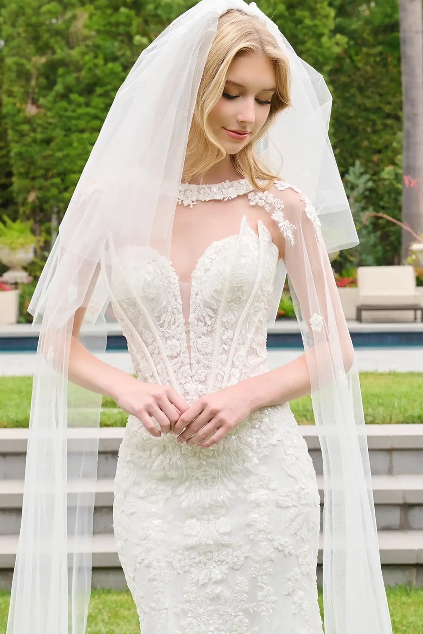 Off-white wedding dress featuring Basque waist silhouette with beads and sequins