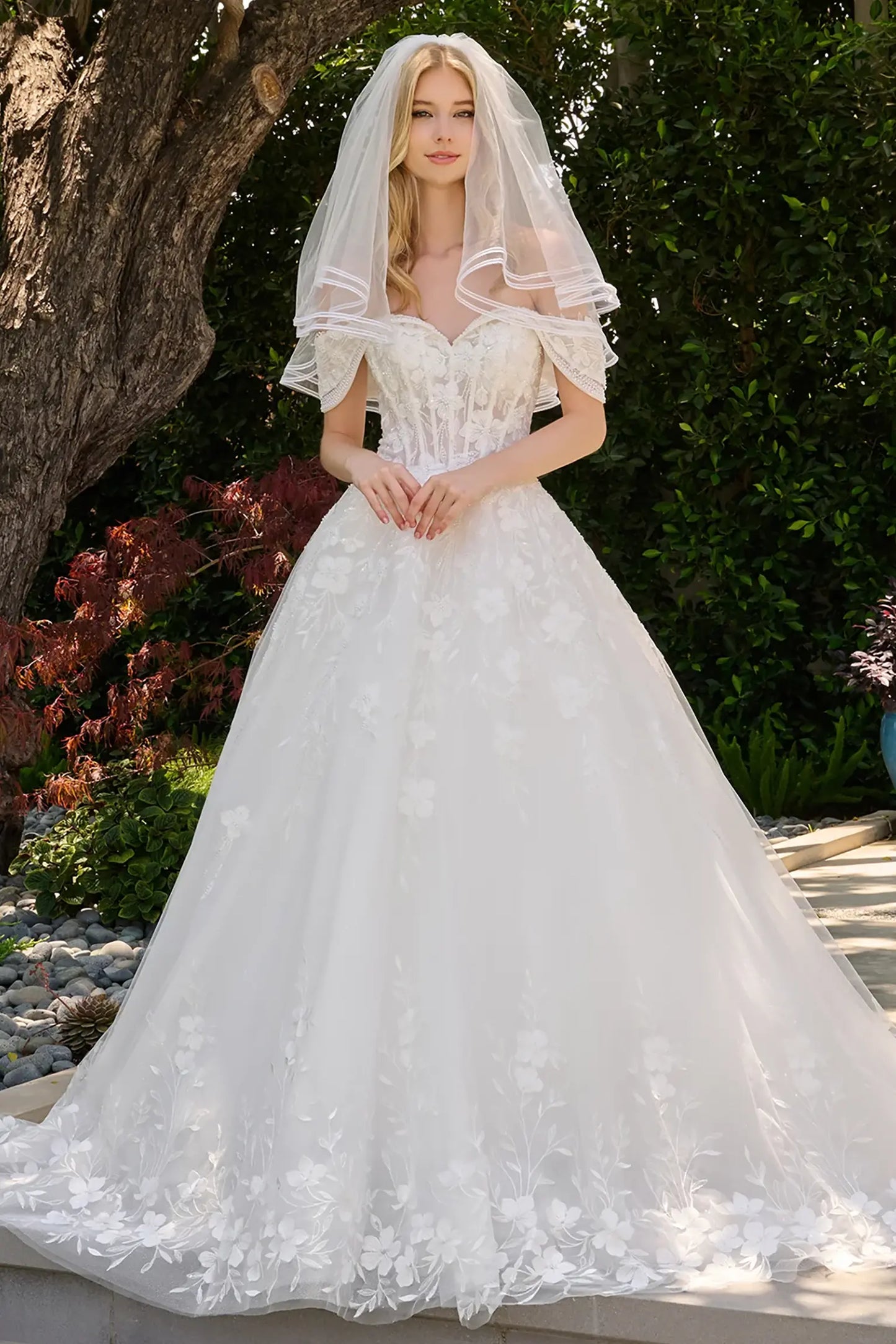 Off-white wedding dress with sweetheart neckline and layered off-shoulder straps