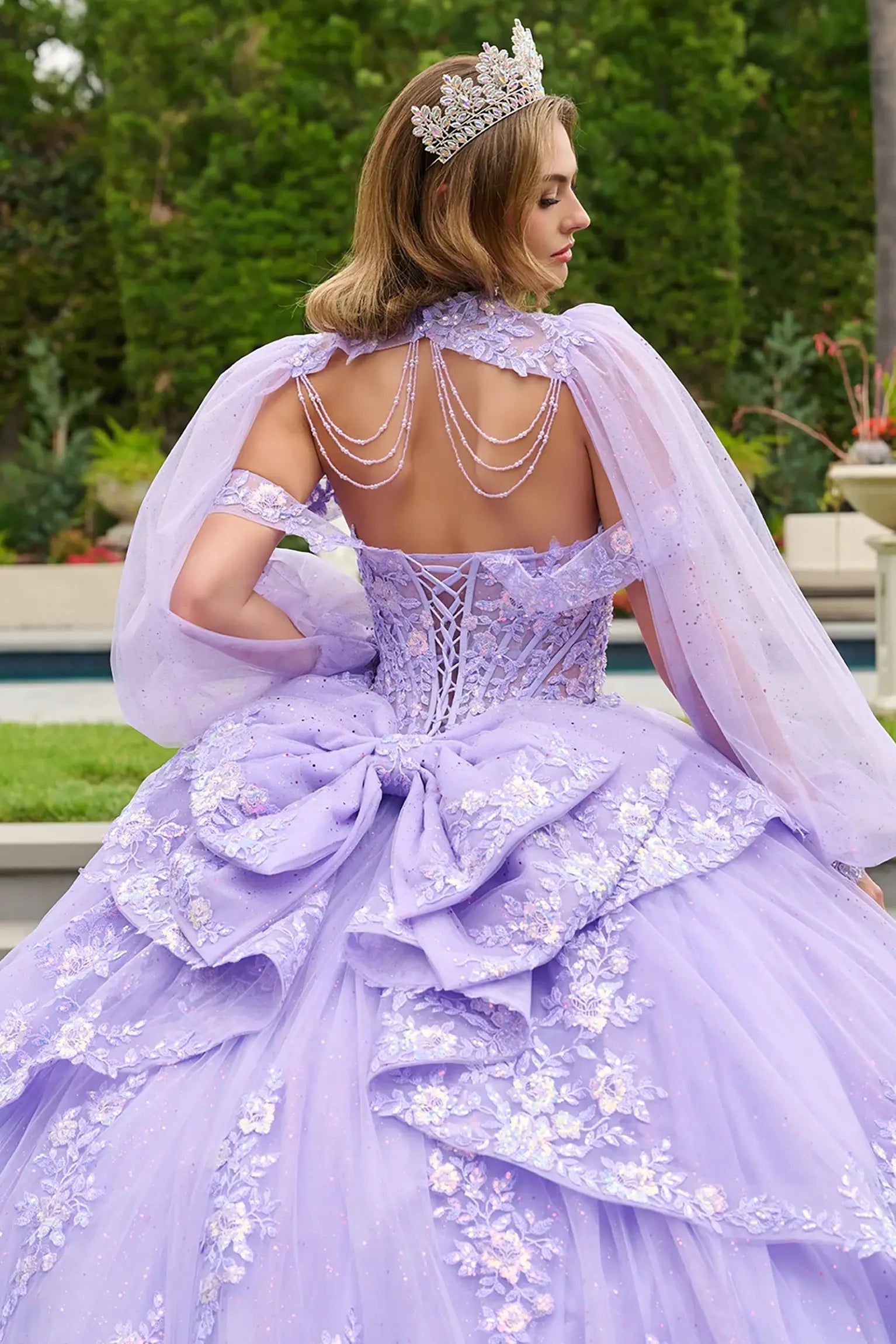 Lilac quinceañera ball gown showcasing glitter mesh bolero that enhances sparkle and shine lace back up