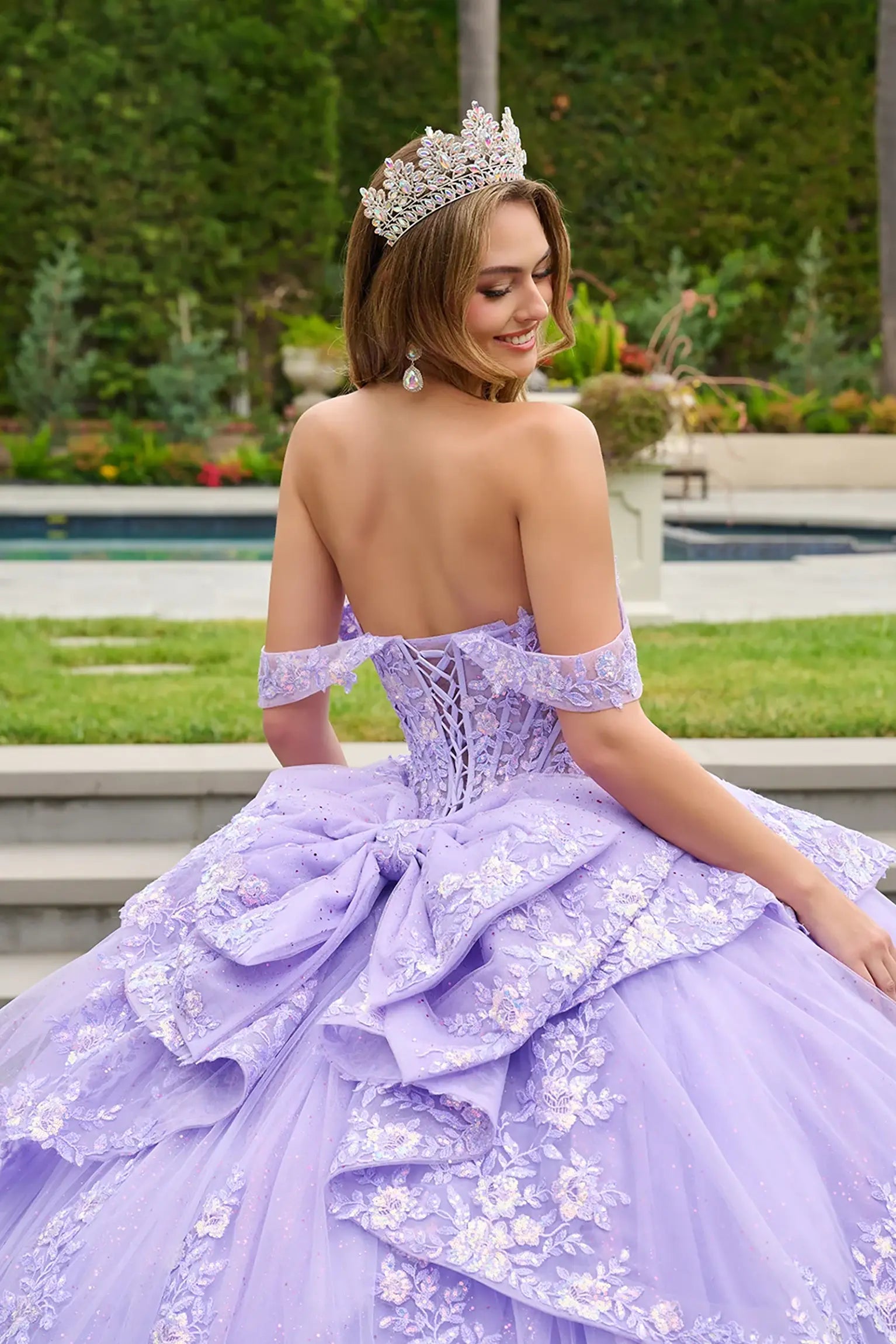 Lilac quinceañera ball gown refined with detachable bow detail and radiant corset embellishments