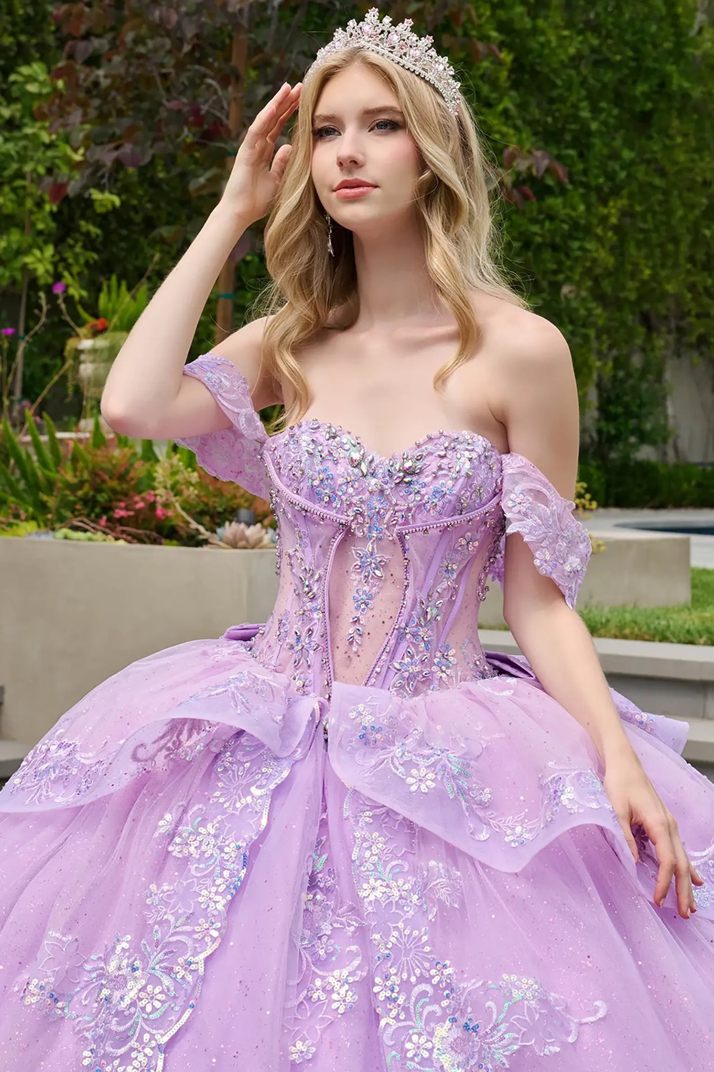 Lilac quinceañera ball gown featuring jewels, sequins, beads and floral embroidery for radiant finish