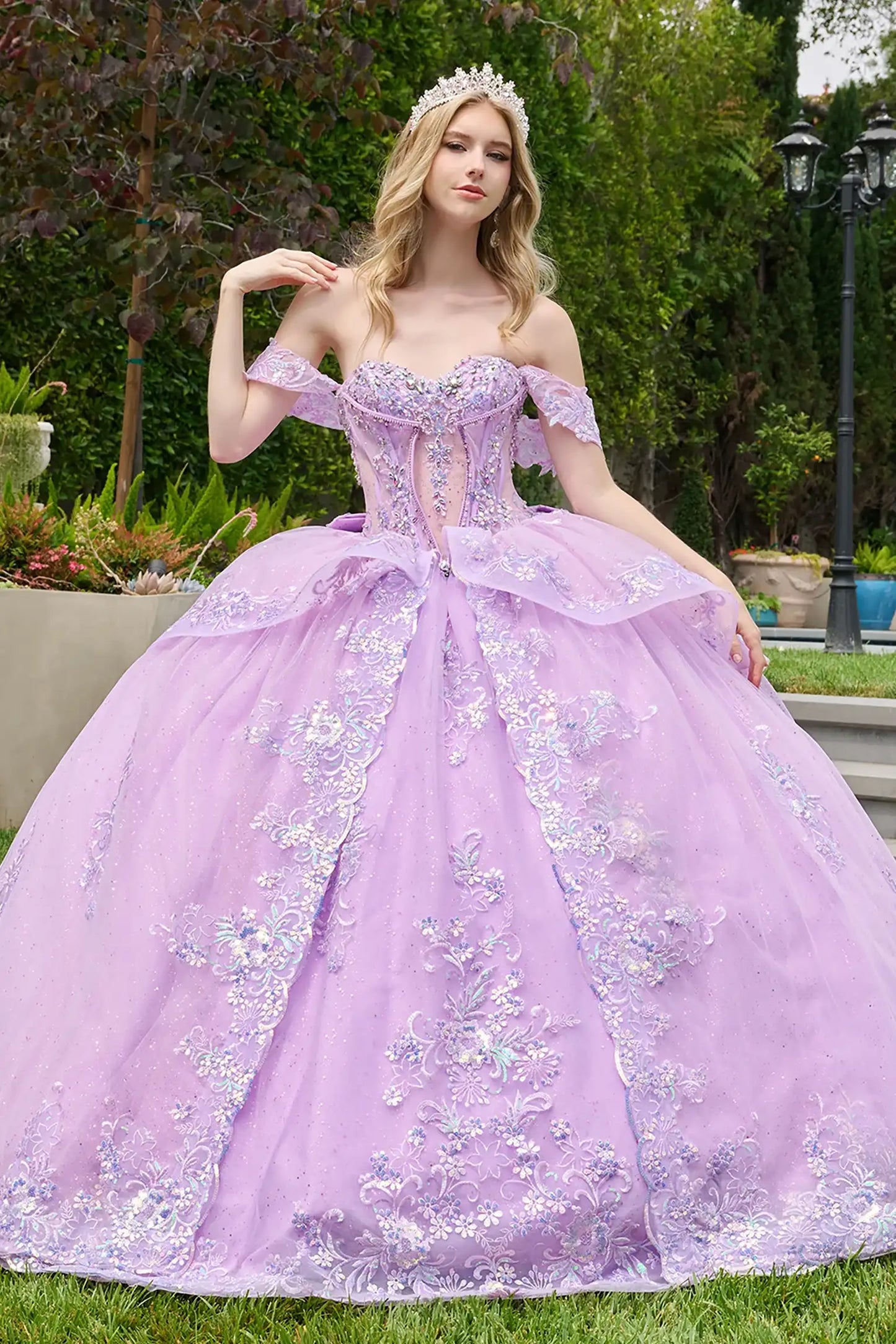 Lilac quinceañera ball gown highlighting ornate corset overlay and refined layered silhouette