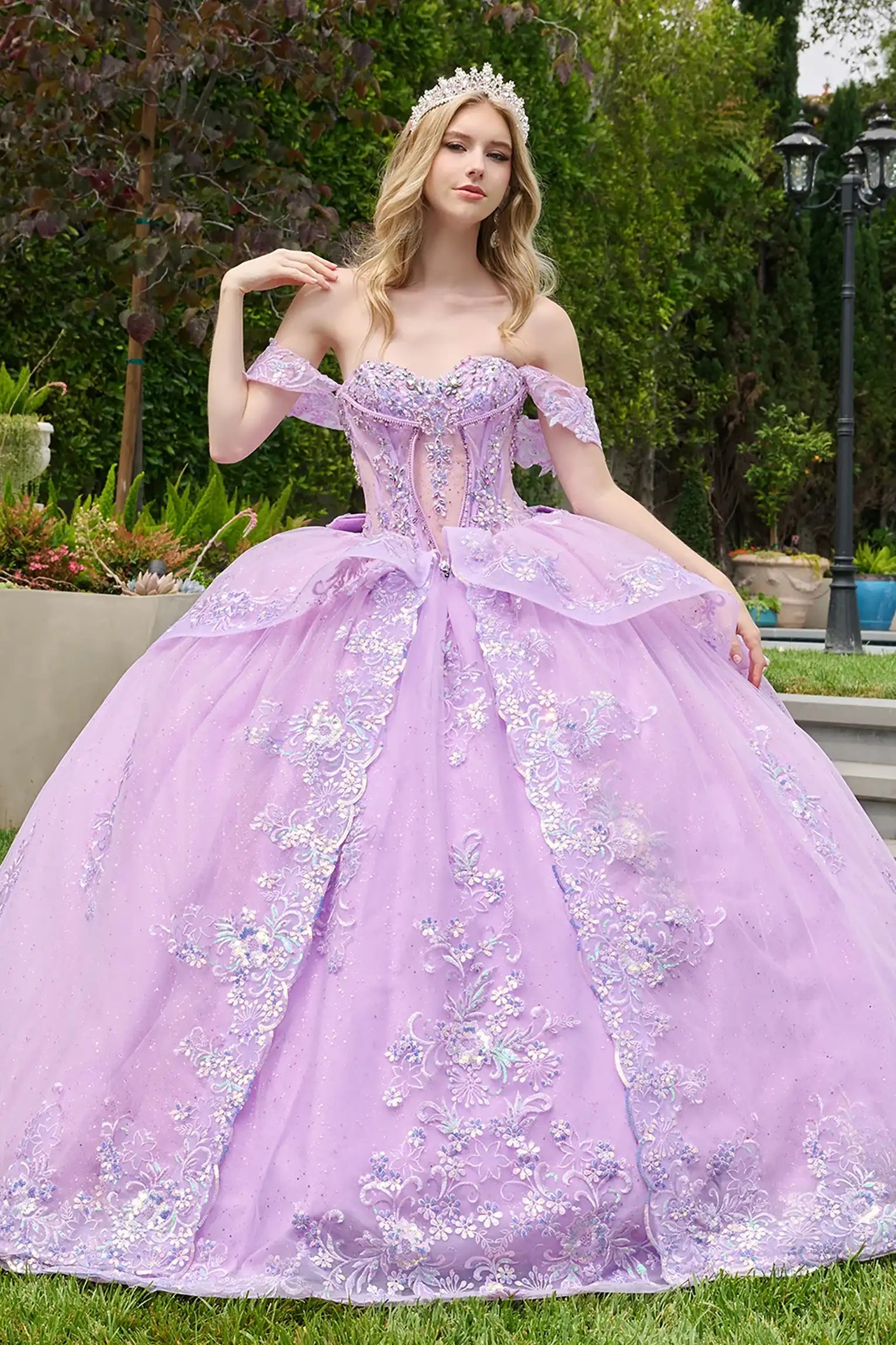 Lilac quinceañera ball gown highlighting ornate corset overlay and refined layered silhouette
