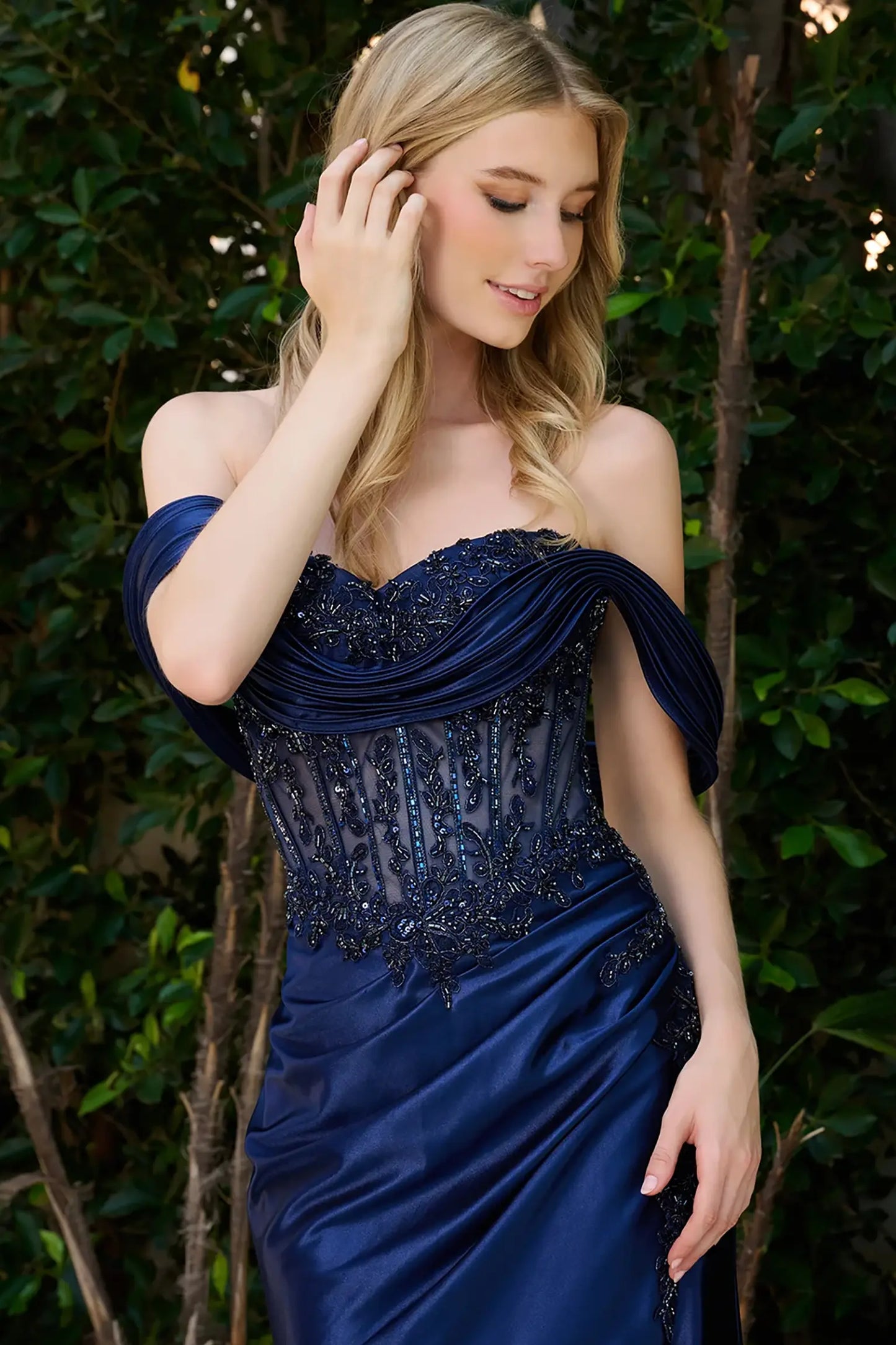 Navy evening gown featuring mesh bodice embellished with beads, sequins, jewels and embroidery