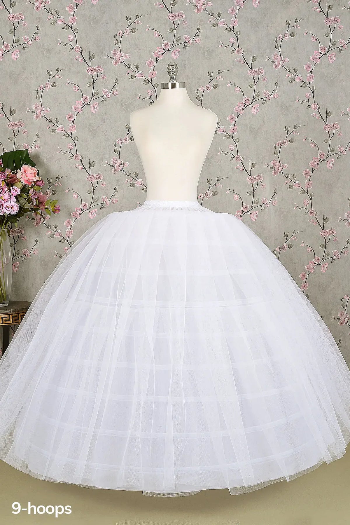 Full view shows White 9-hoop tulle quinceañera petticoat with layered volume.