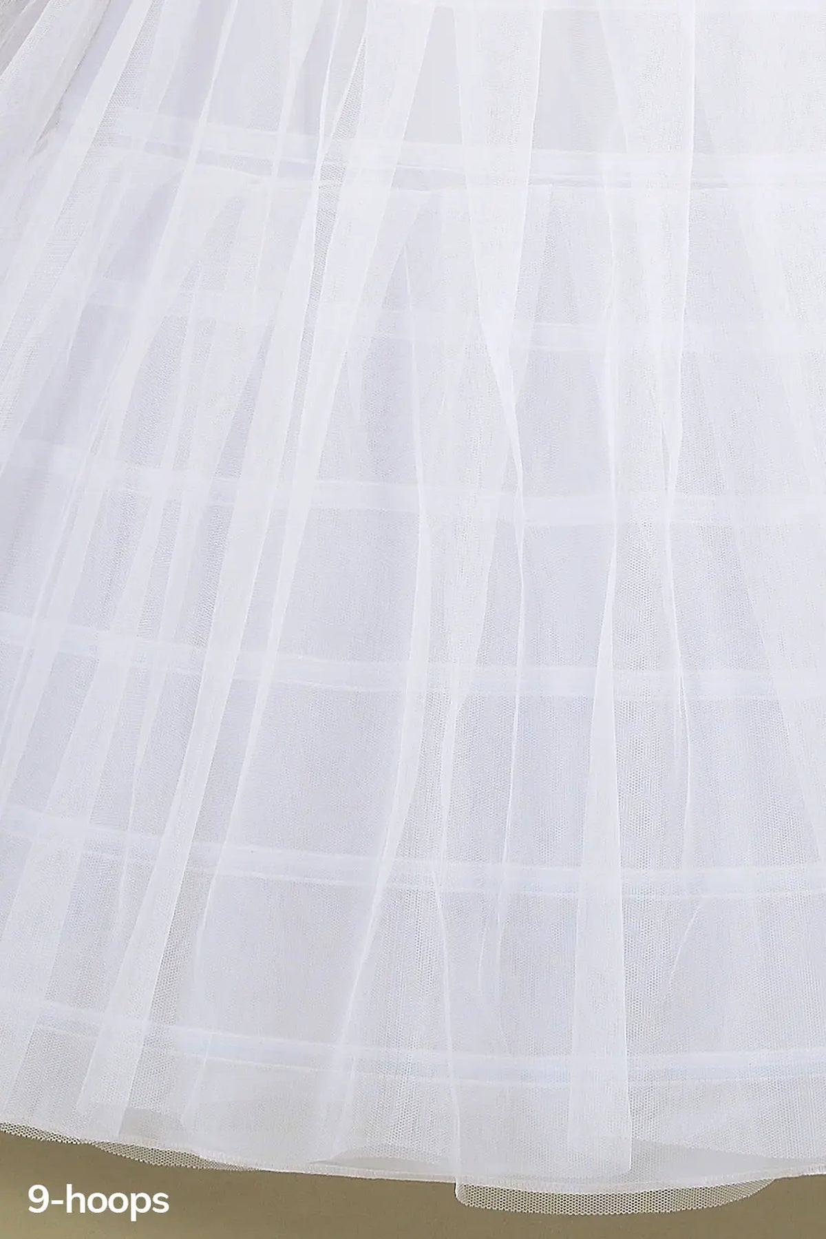 Hoop structure shapes the White quinceañera petticoat with 9-hoop tulle.