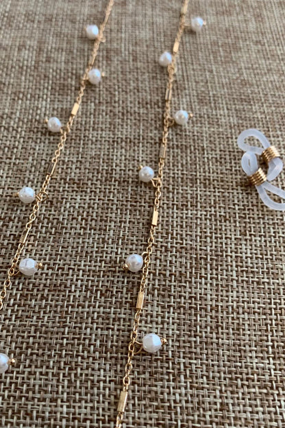 Close-up view reveals pearl 14K Gold Plated-plated everyday women's reading glasses chain.