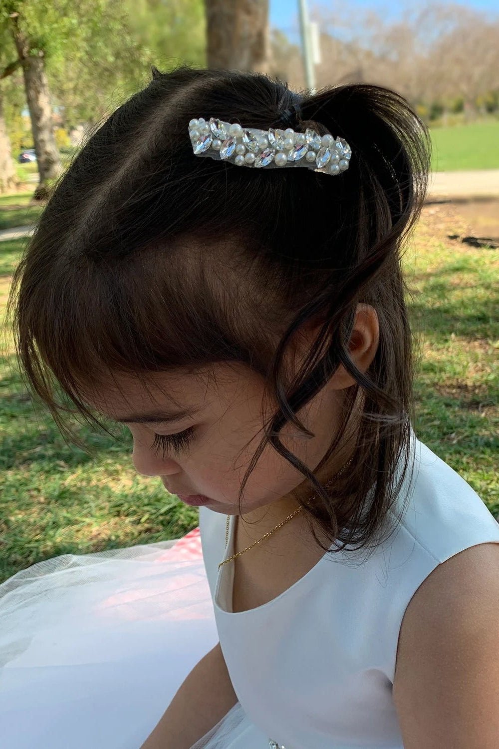 Silver pearl rhinestone flower girl hair clip.
