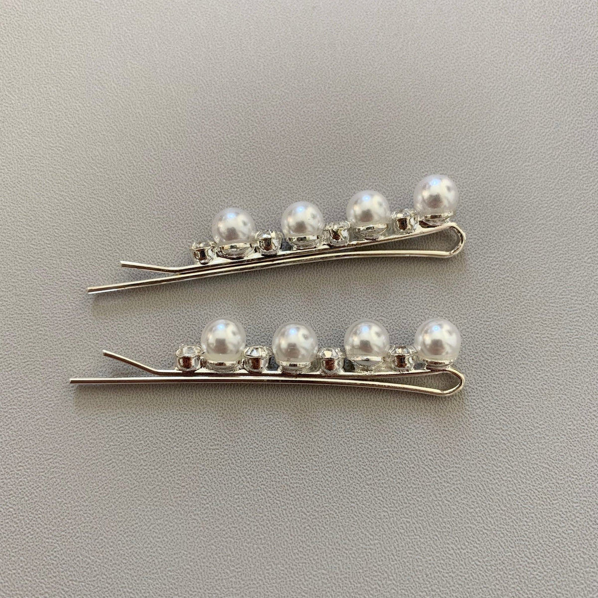 Silver pearl rhinestone flower girl hair pins, side view.