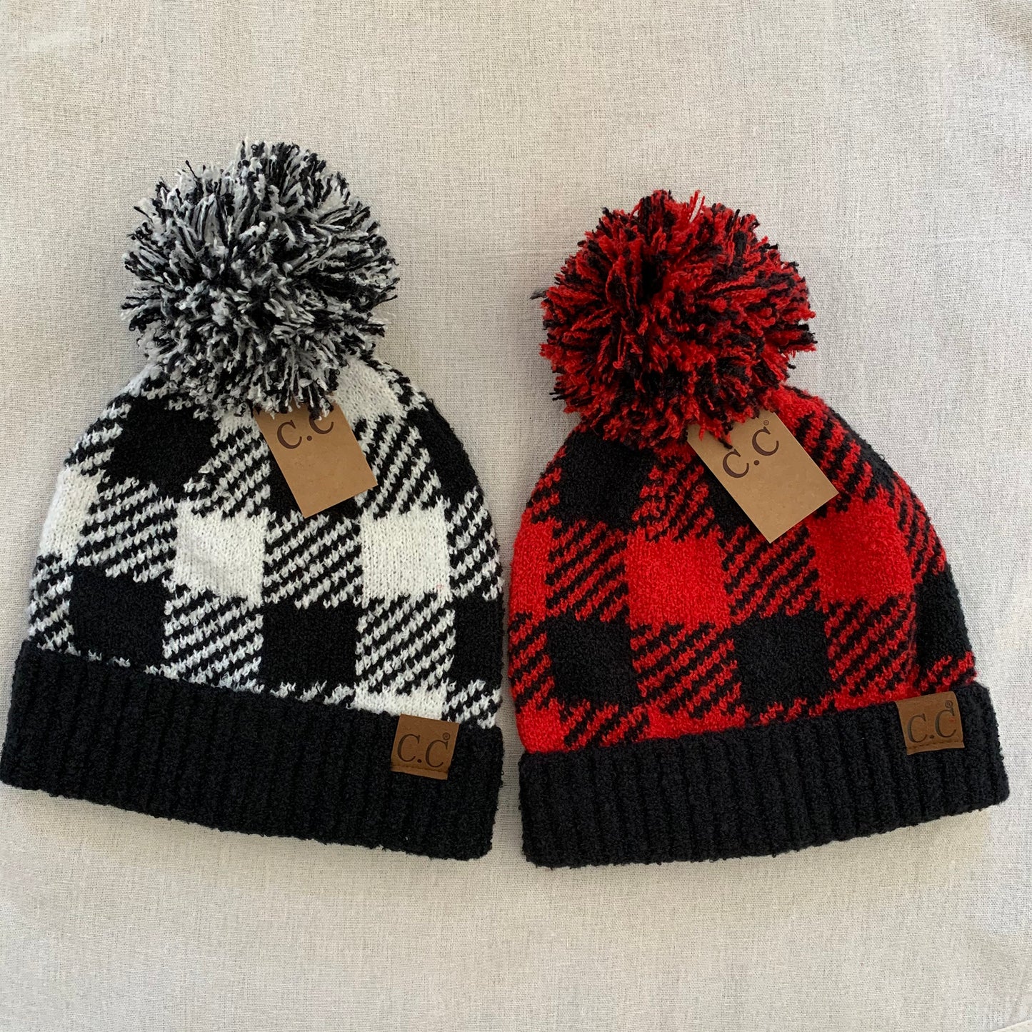 Black red plaid pom-pom women's winter beanie, color assortment.