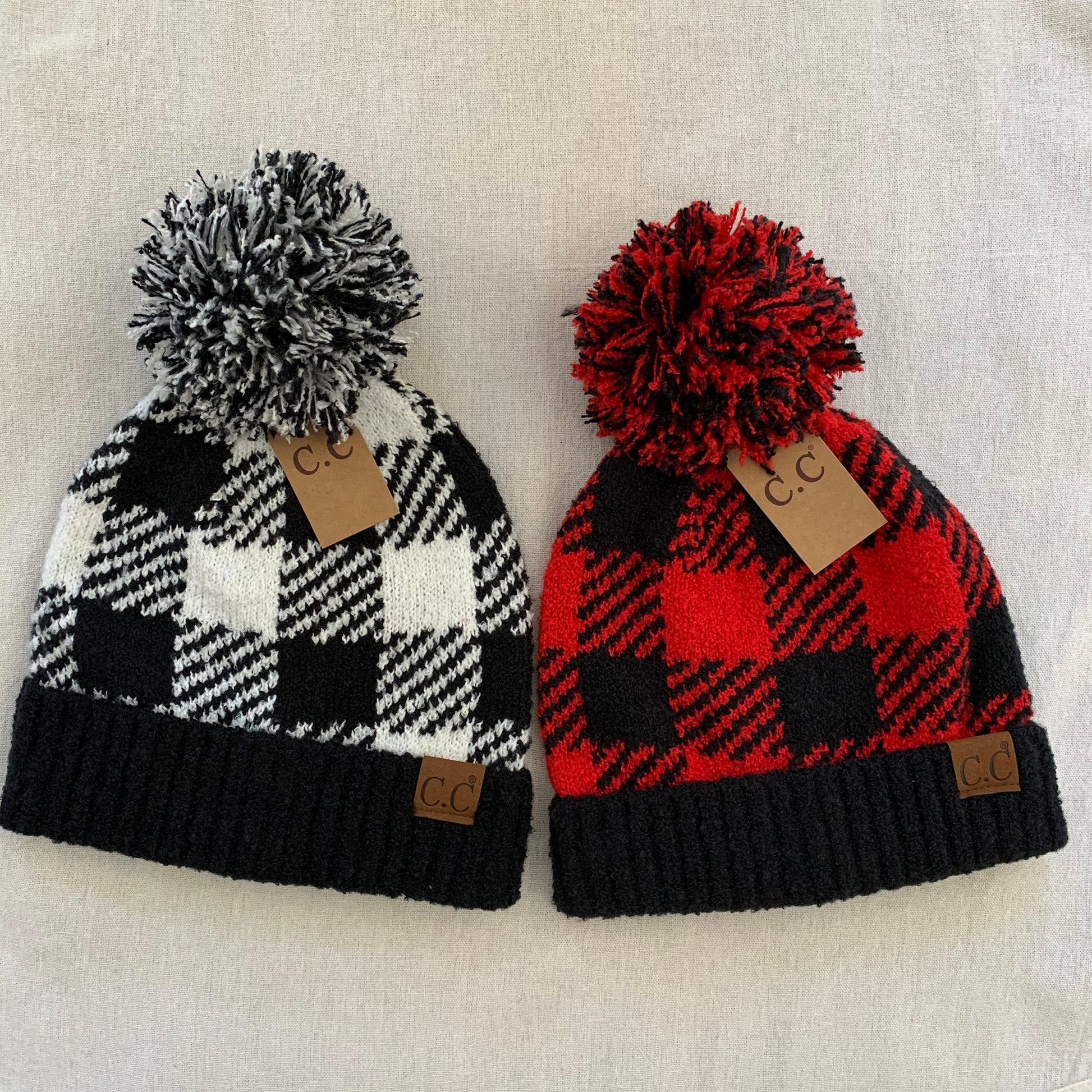 Black red plaid pom-pom women's winter beanie, color assortment.