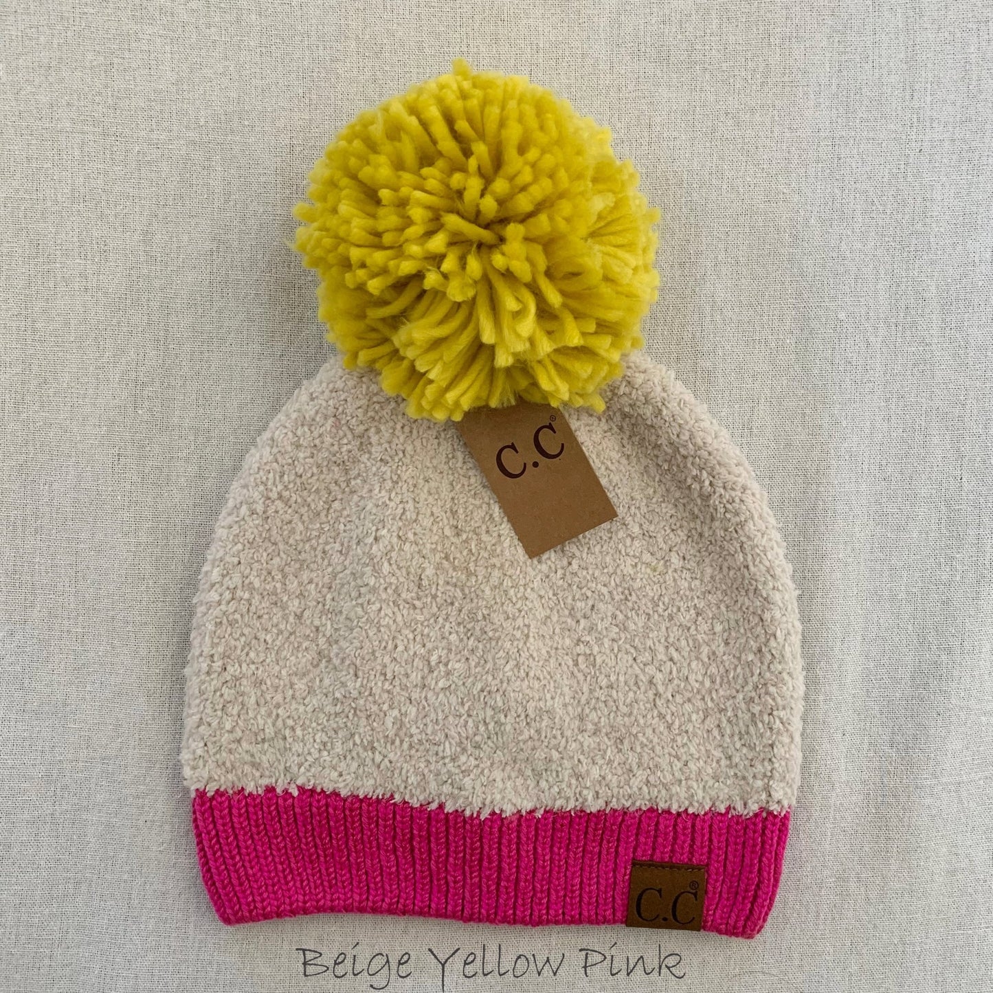 Yellow sherpa pom-pom women's winter beanie.