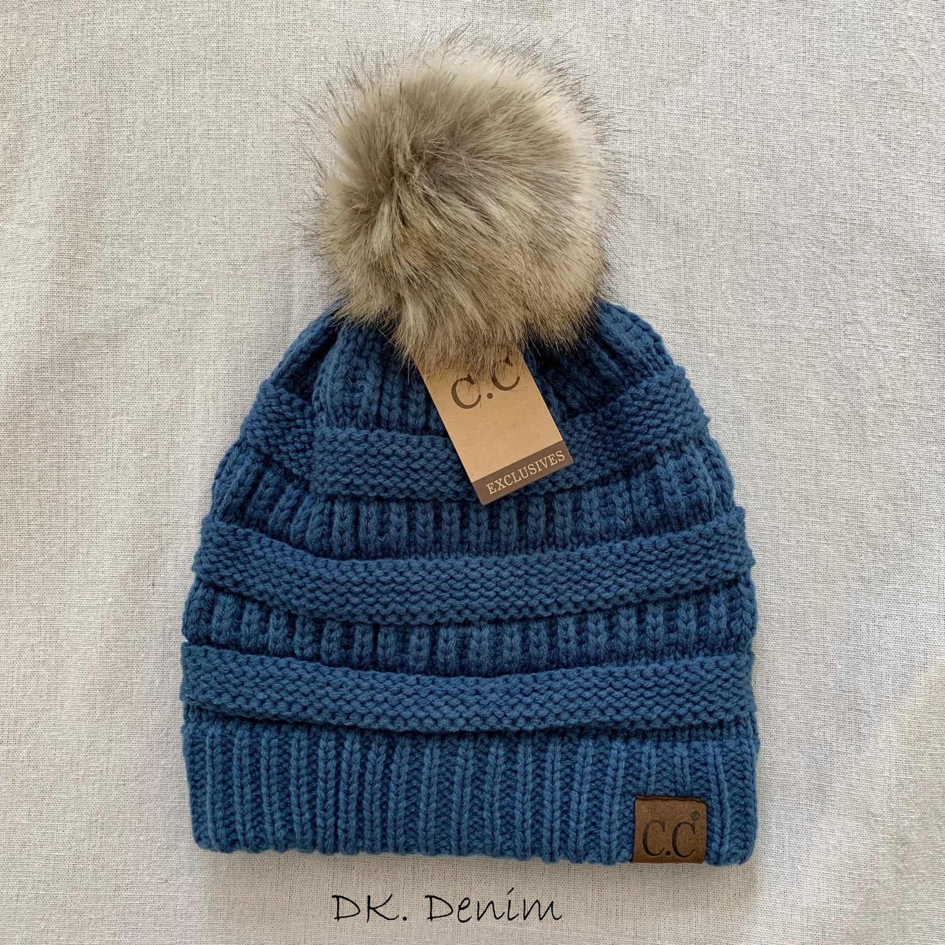 Denim pom-pom women's winter beanie.