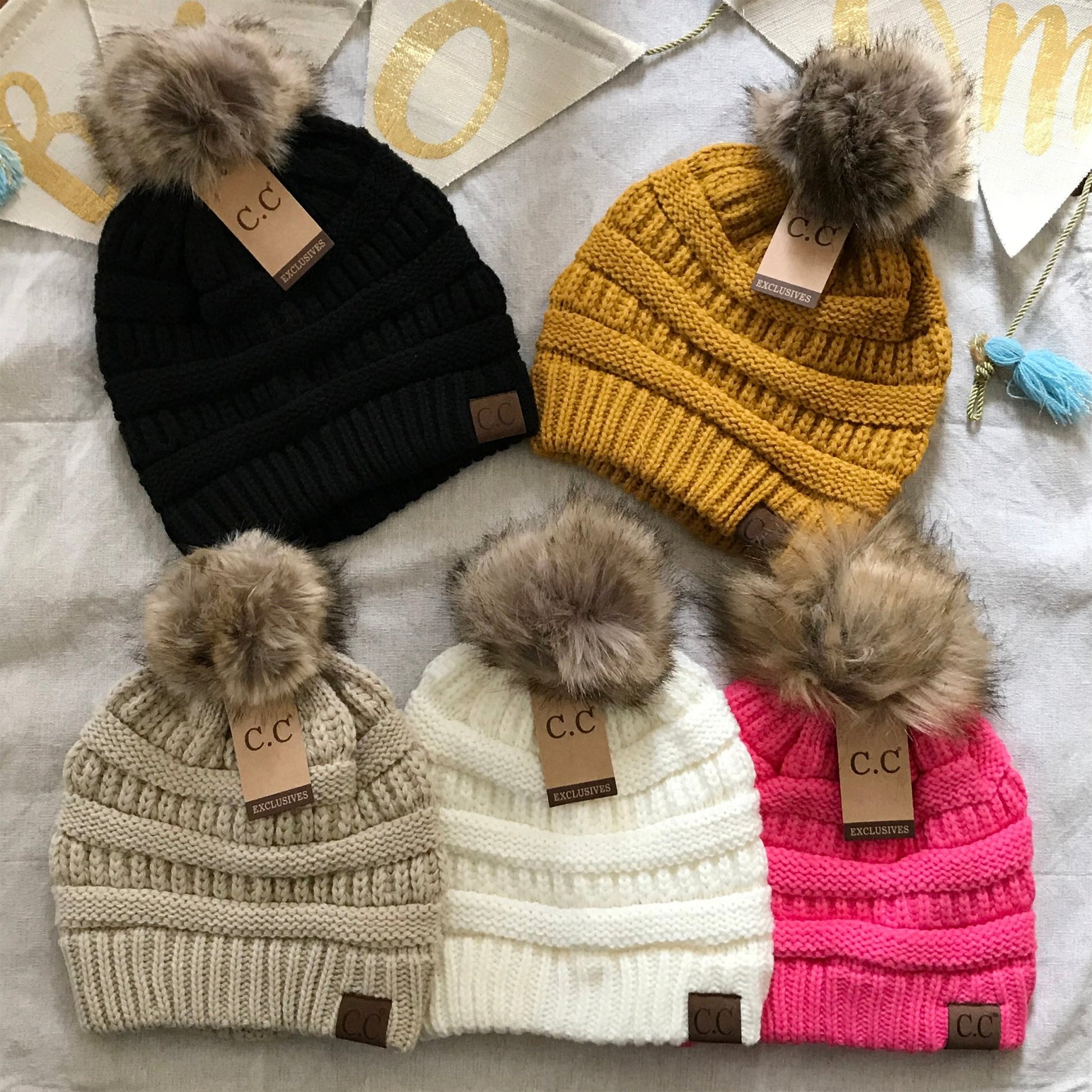 Multi color pom-pom women's winter beanie, color assortment.