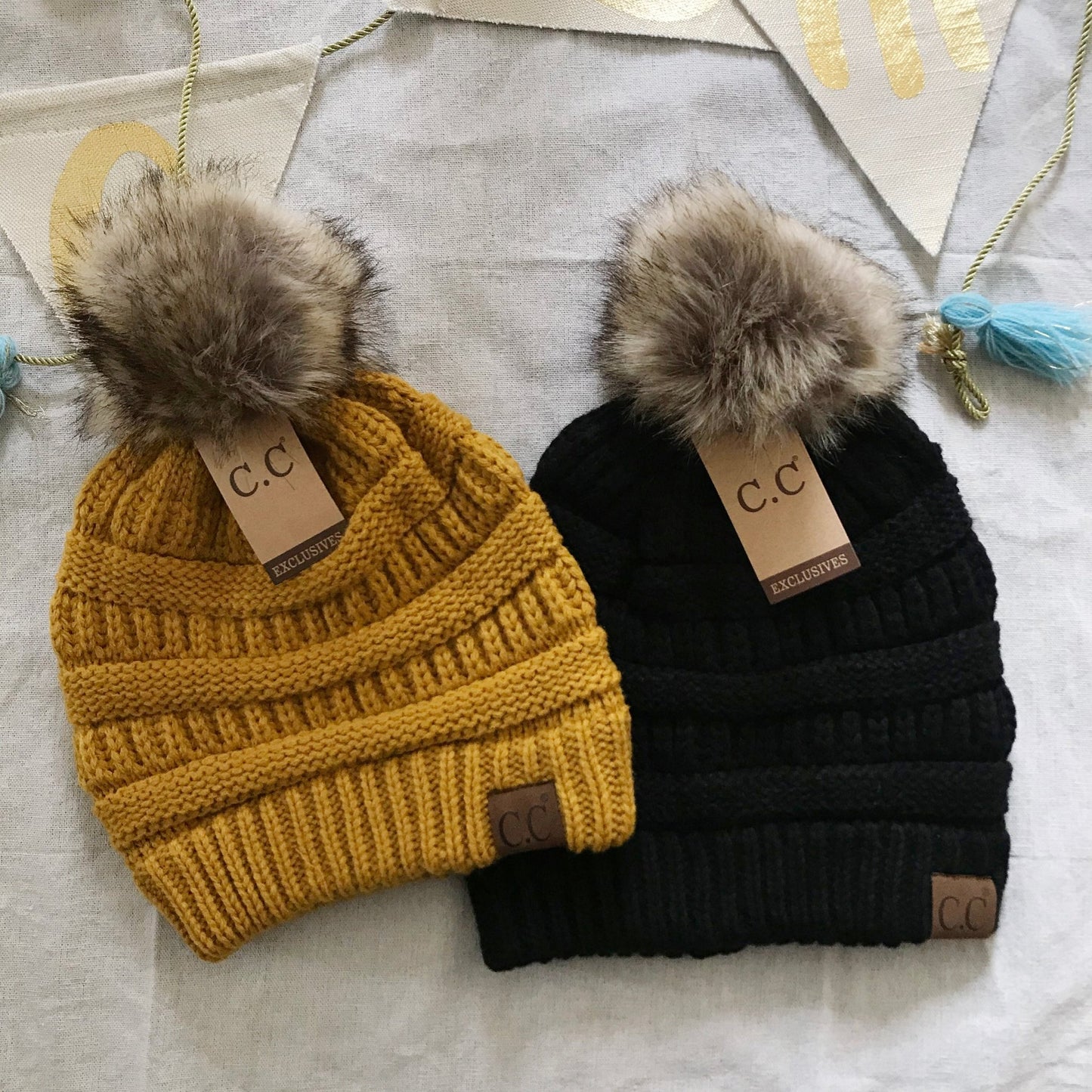 Mustard black pom-pom women's winter beanie.