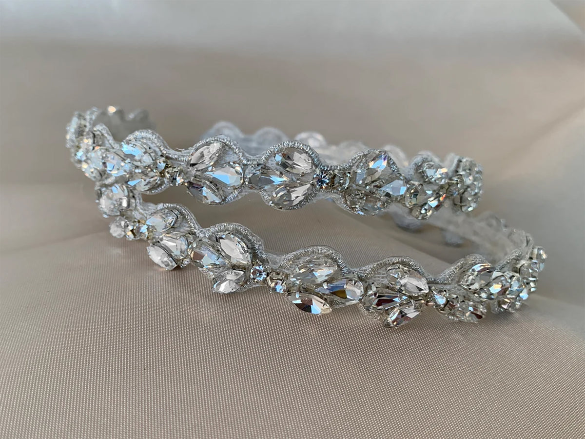Clear rhinestone flower girl headband, close-up, embellishment detail.