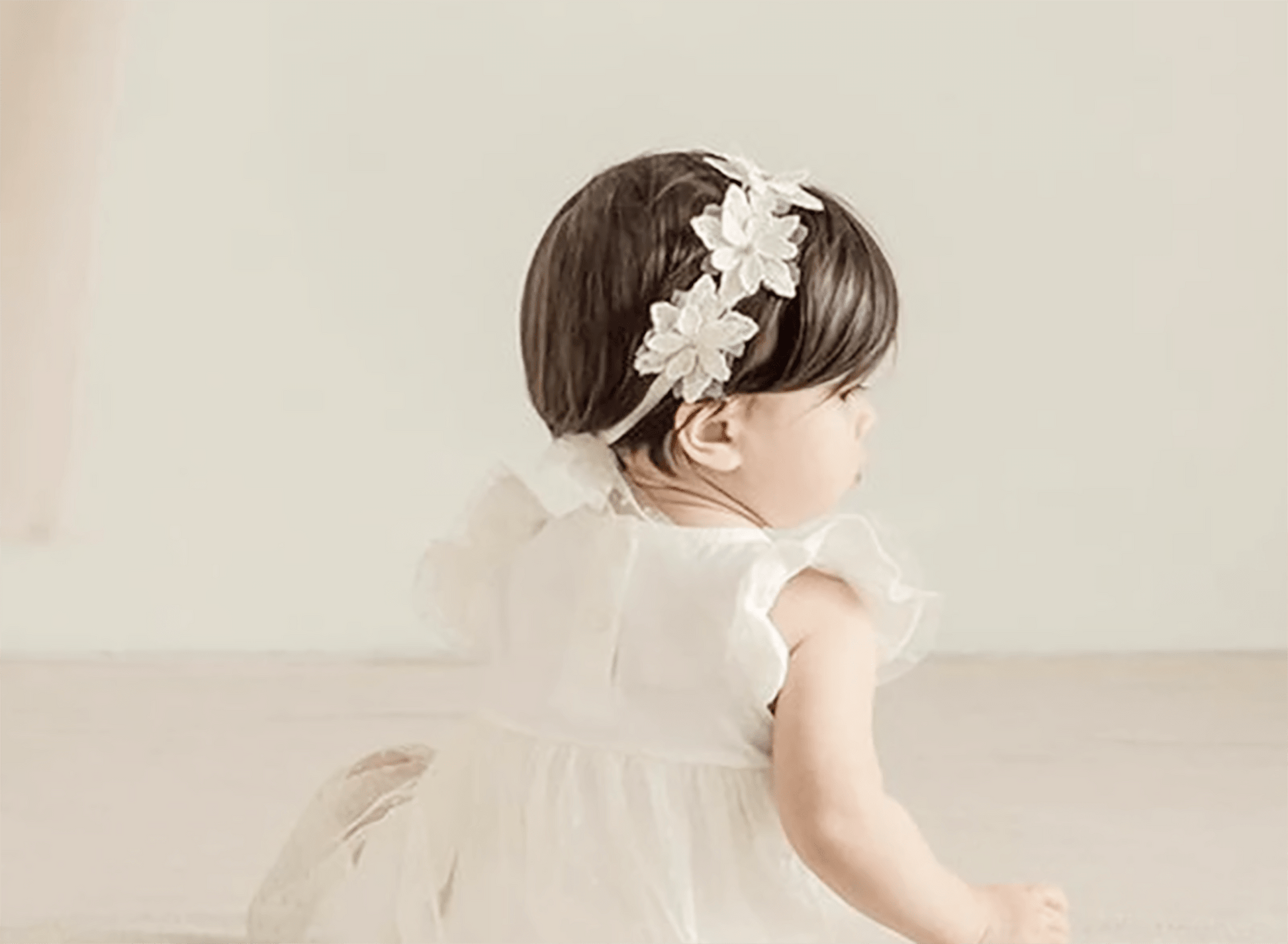 Off white rhinestone floral flower girl headband, back view.