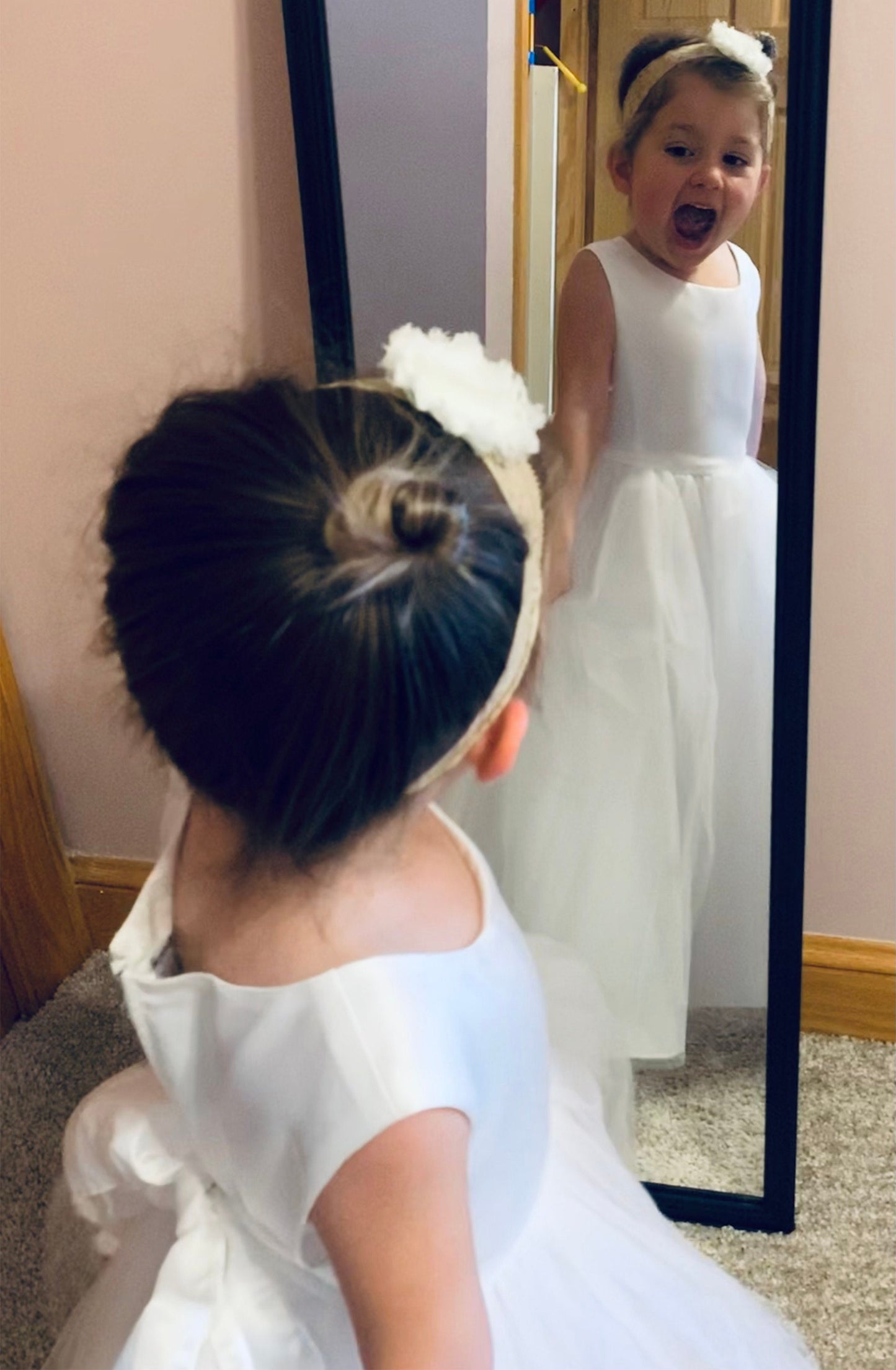 USA Made | Simple Classic 4 Layer Tulle and Satin Top Flower Girl Dress | Perfect flower girl dress | Size 6M - Teen - girl wearing dress happily looking into a mirror