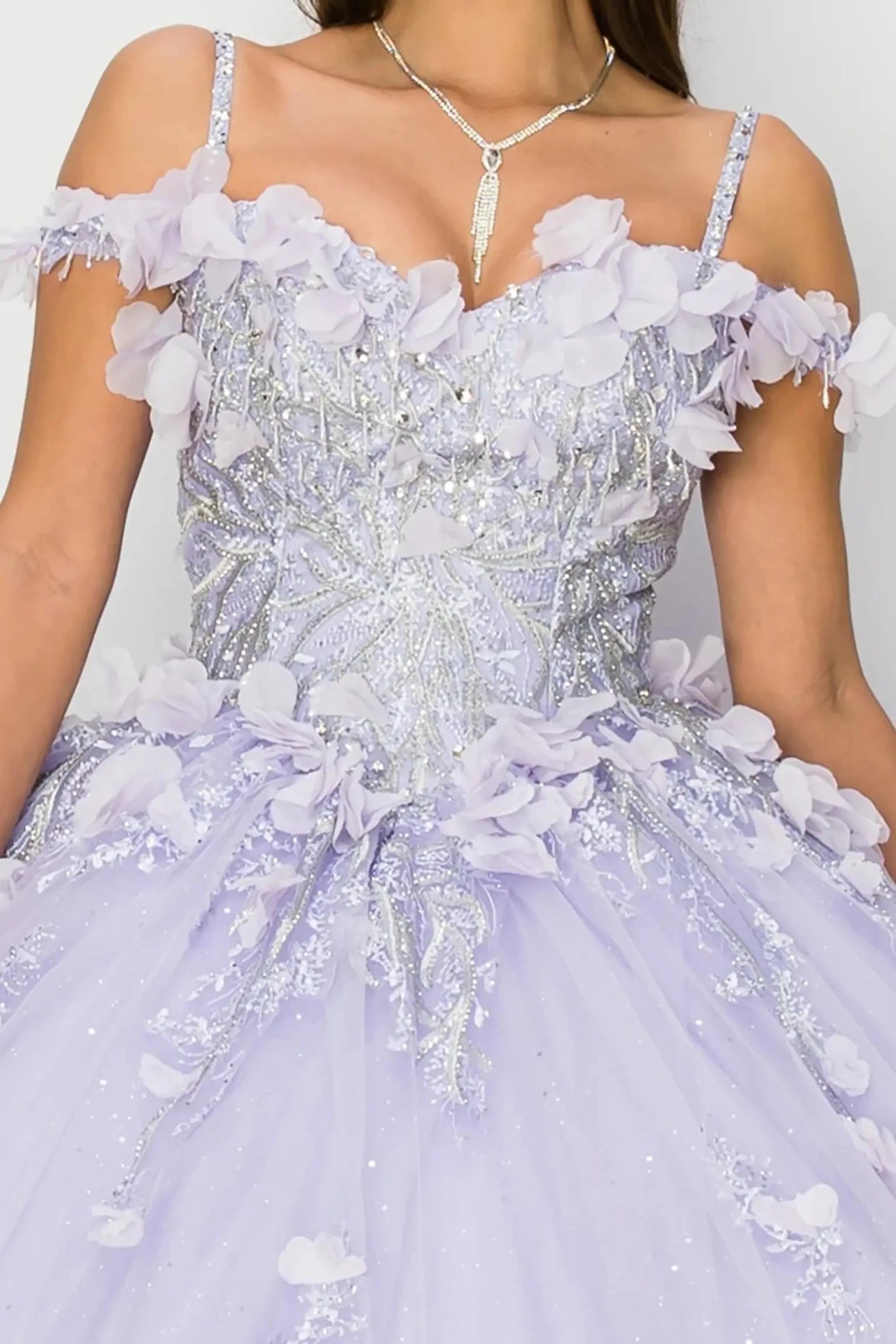 Close-up of a lavender evening gown with floral and beaded details.