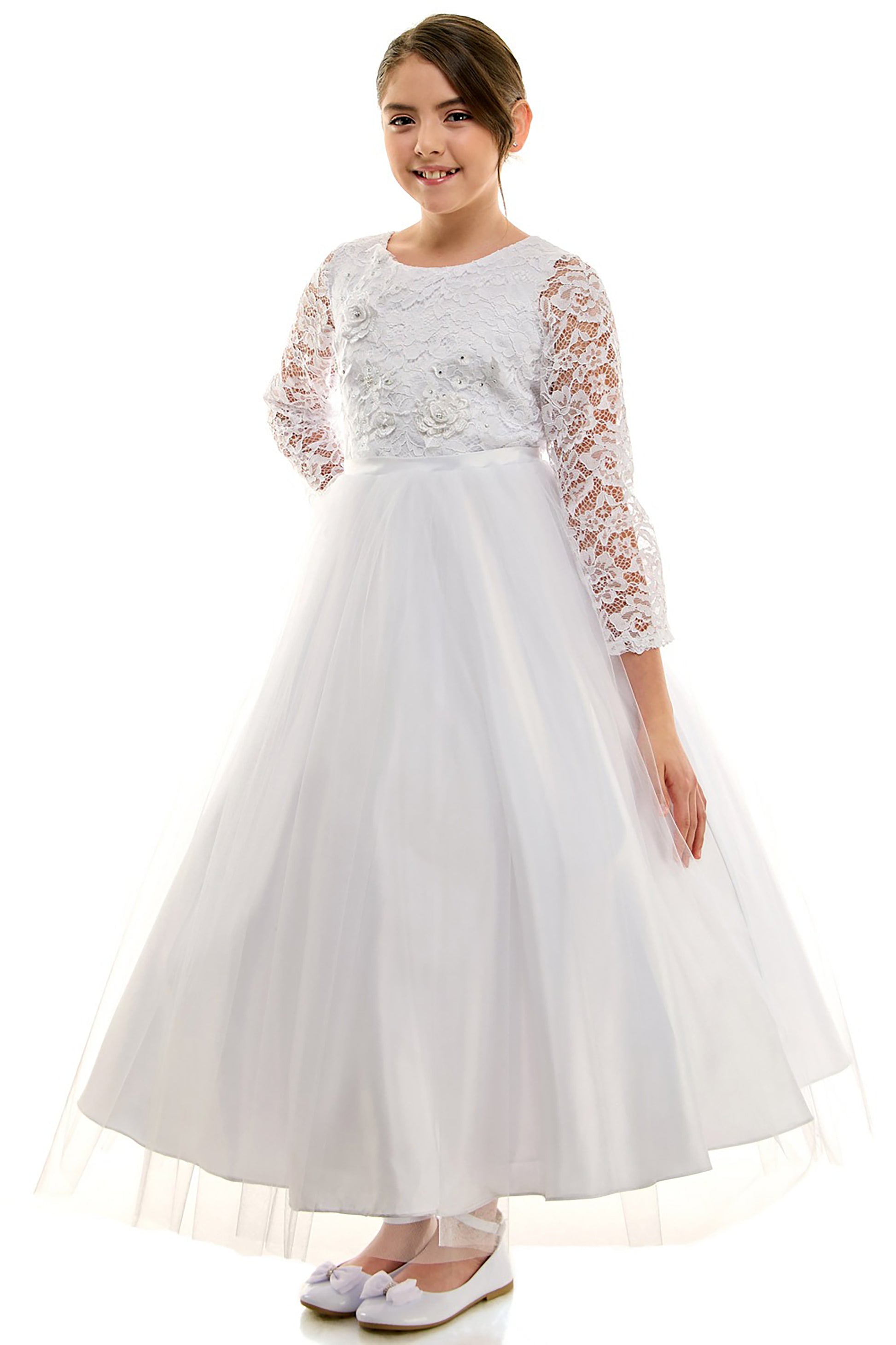 White dress with lace sleeves worn by a girl on a white background