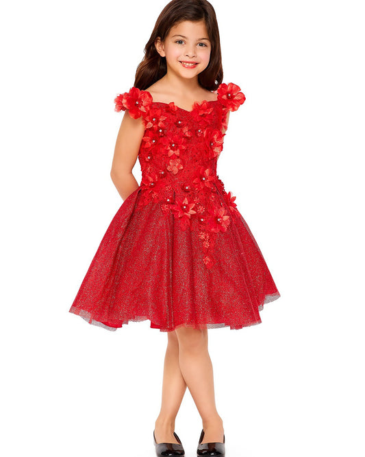Young girl wearing a red floral dress on a white background