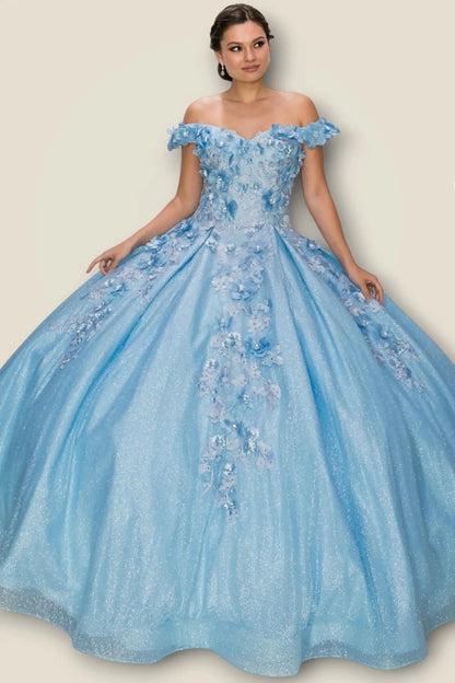 Woman wearing a blue off-shoulder gown with floral embroidery on a beige background