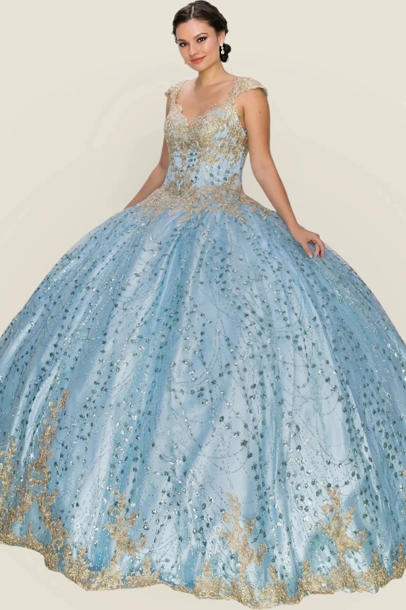 Blue and gold ball gown on a plain background