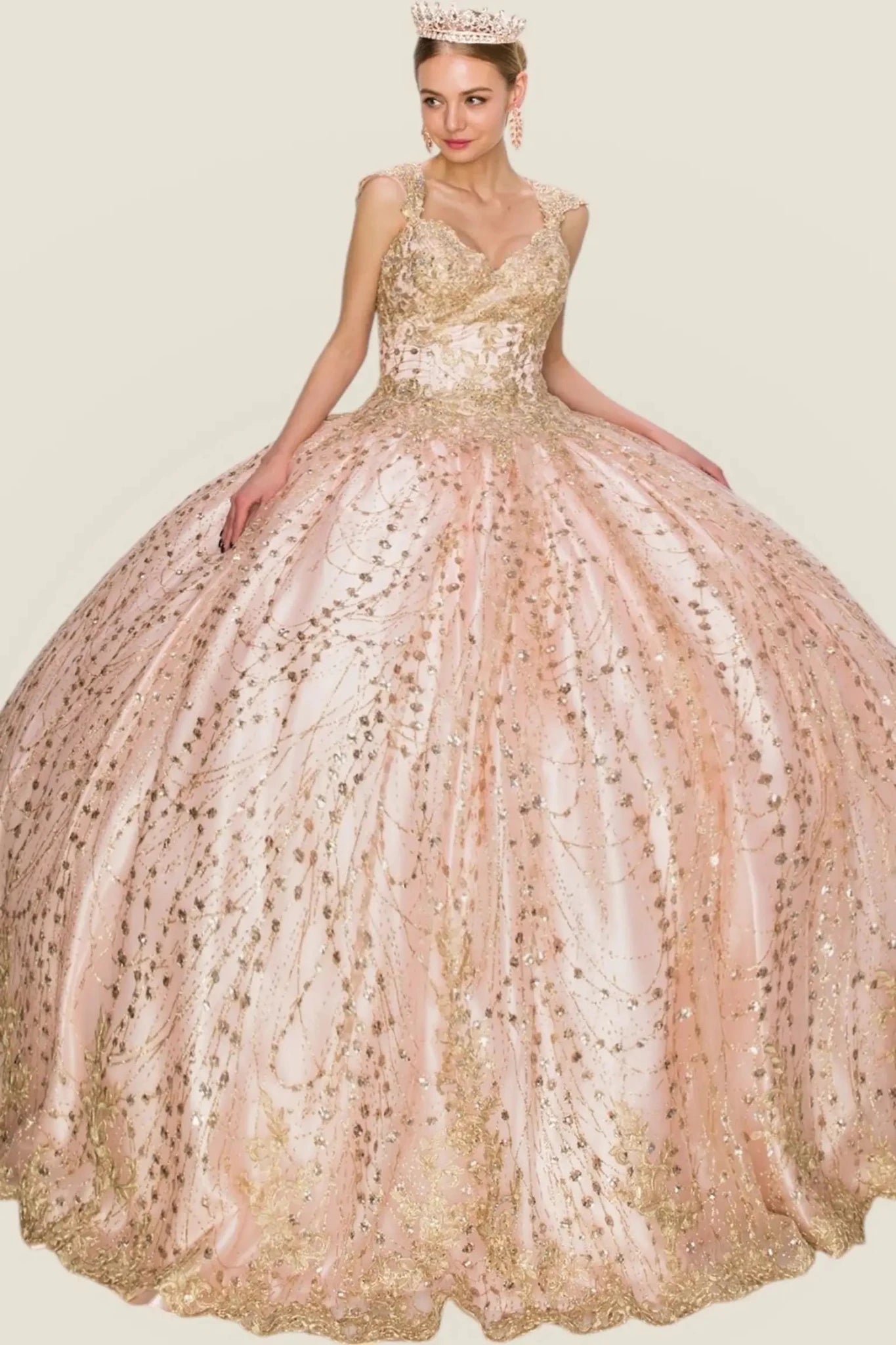 Elegant blush ball gown with sequin details on a plain background