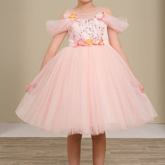 girl wearing a pink tulle dress