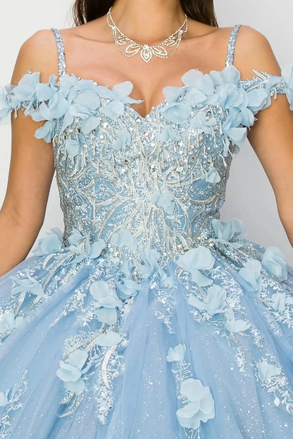 Light blue quince ball gown with floral details and a necklace on a plain background