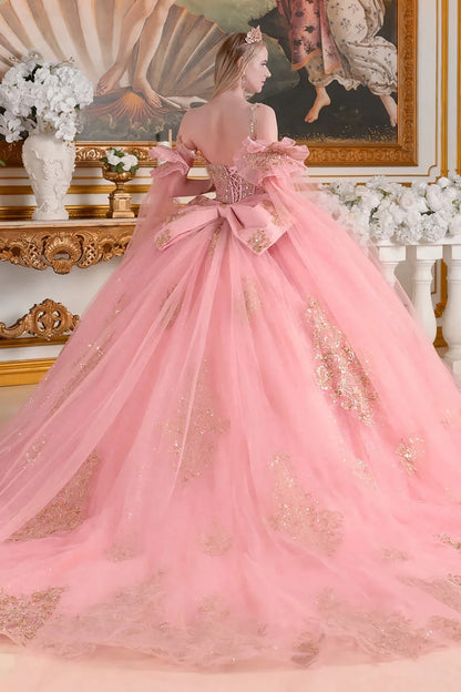 dusty rose ball gown with gold accents in an elegant room setting