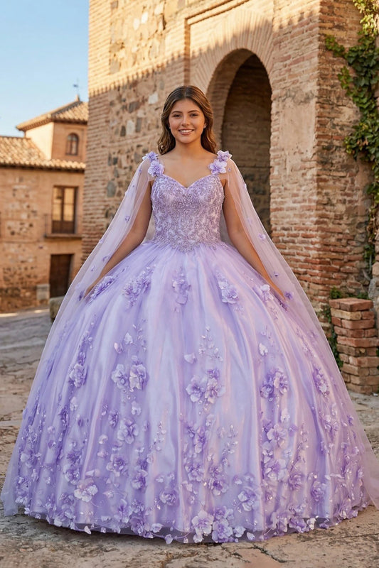 Woman in a lavender floral quinceanera dress standing in front of an old stone building.