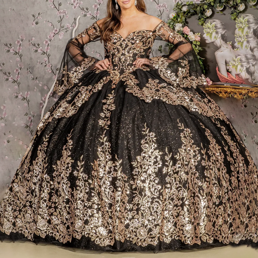 Black and gold embroidered gown with floral decorations on a decorative background