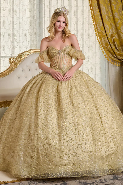 Woman in a gold gown with a tiara in an elegant room.