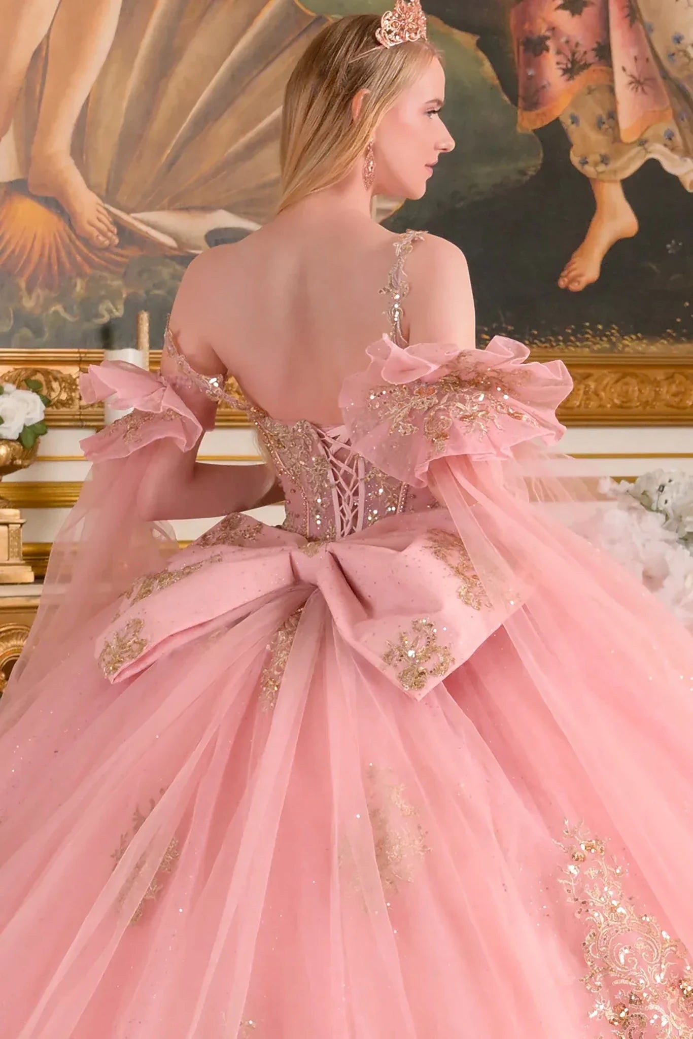 dusty rose ball gown with intricate details in a classical setting