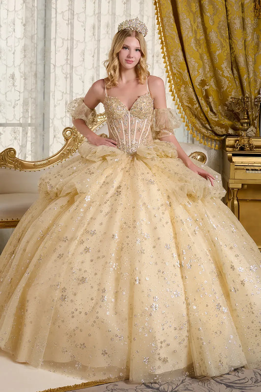 Woman in a gold ball gown with intricate details in a opulent room.