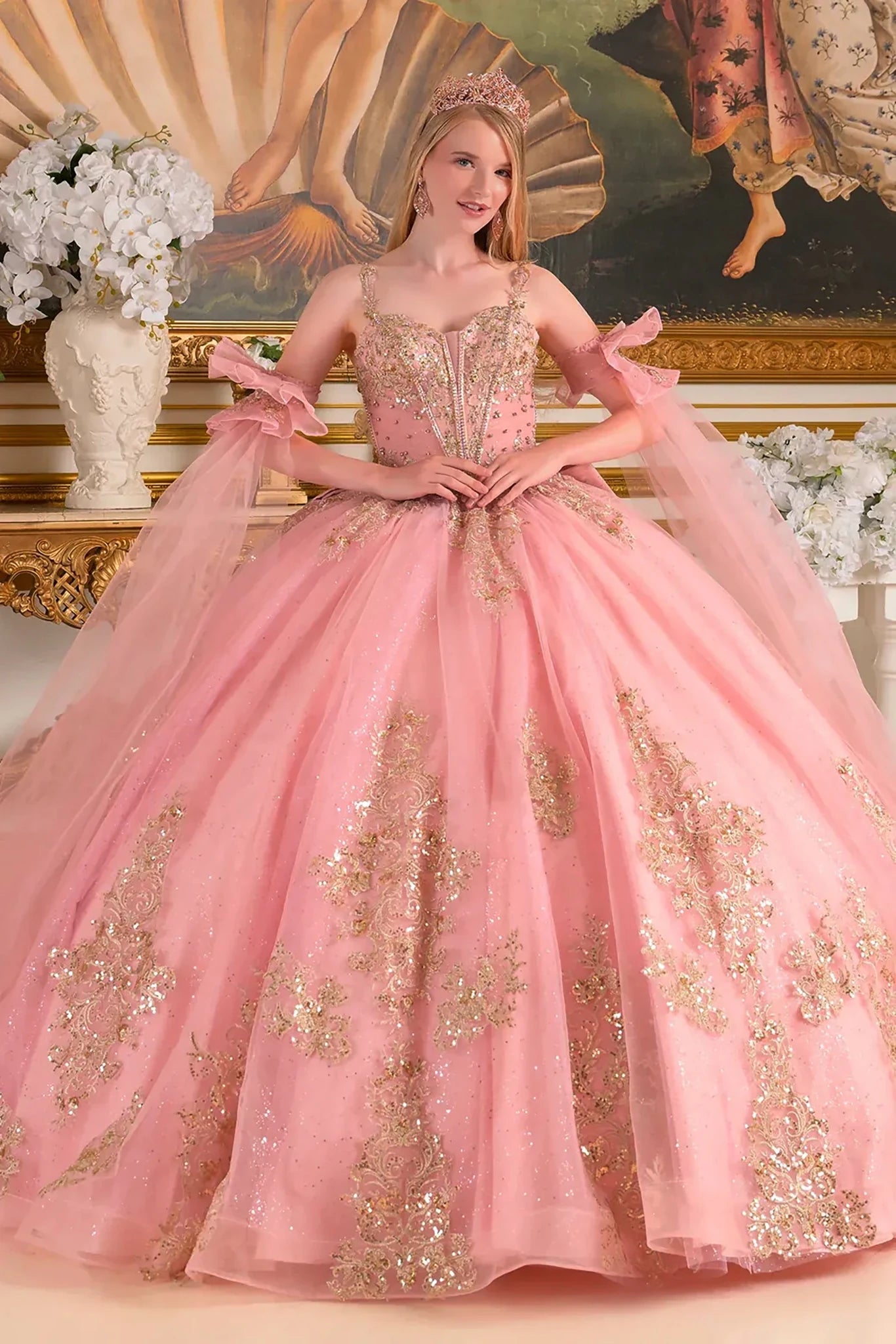 dusty rose ball gown with gold embroidery in a decorative setting