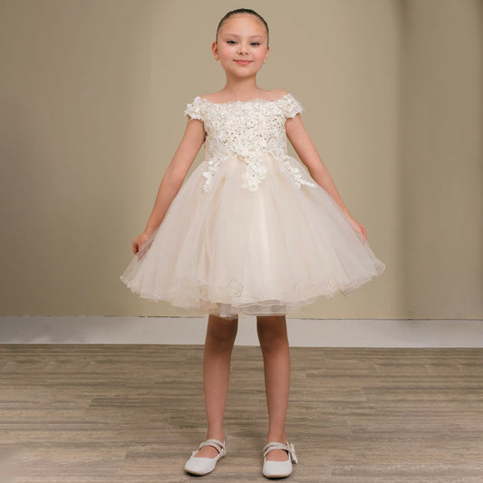 Young girl wearing a white floral dress against a plain background