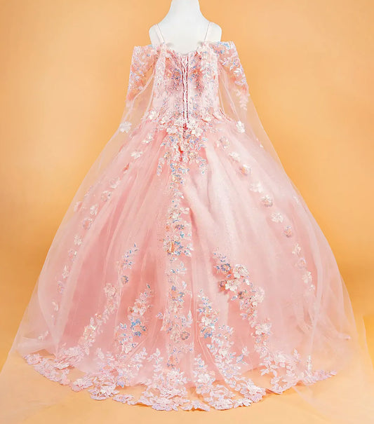 blush kid floral dress on a mannequin against an orange background