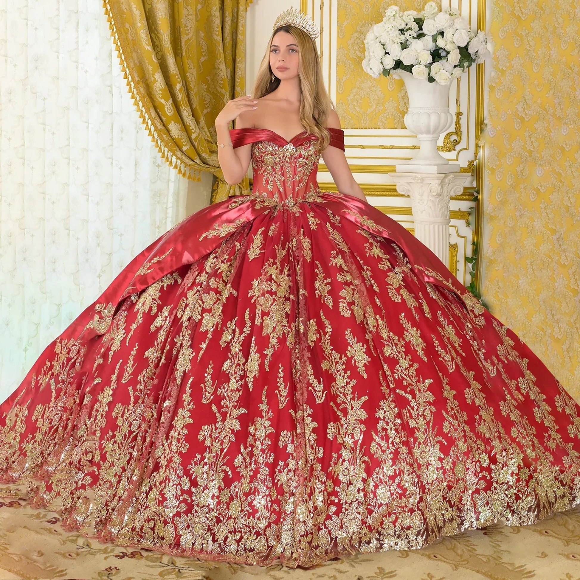 girl wearing burgundy ball gown with gold embroidery in an elegant room front view