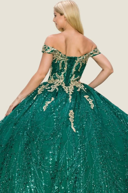Green sequin dress with gold detailing worn by a model on a beige background
