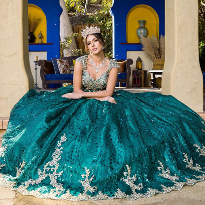 Woman in a green sequined gown with a blue and yellow architectural background