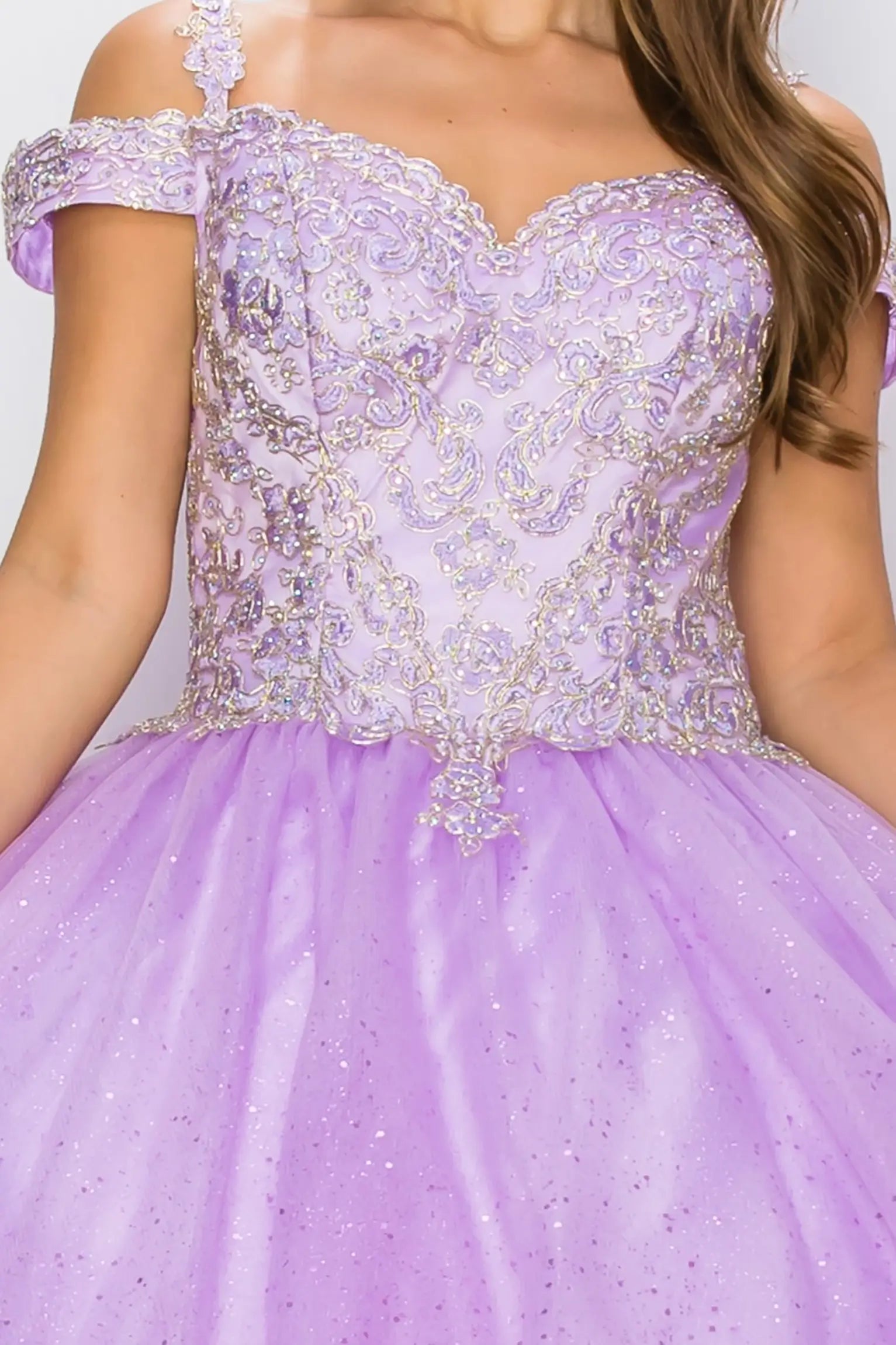 lilac off-shoulder dress with intricate detailing on a plain background