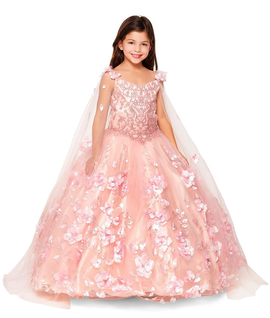 Young girl wearing a pink floral gown with a white background