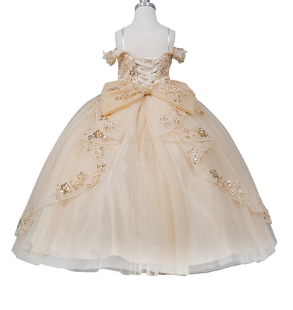 Beige flower girl dress with gold embellishments on a mannequin against a white background