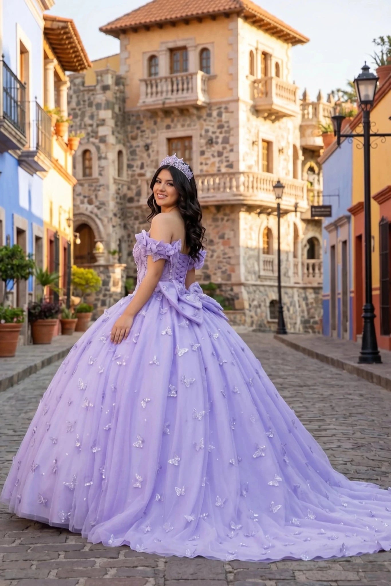 Woman in a purple ball gown standing on a street with colorful buildings in the background