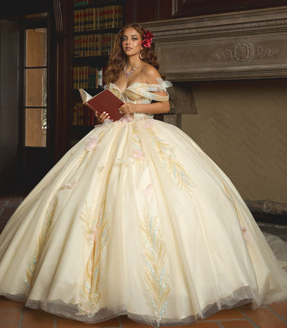 Woman in a white gown with floral details holding a red book in a room with a fireplace.