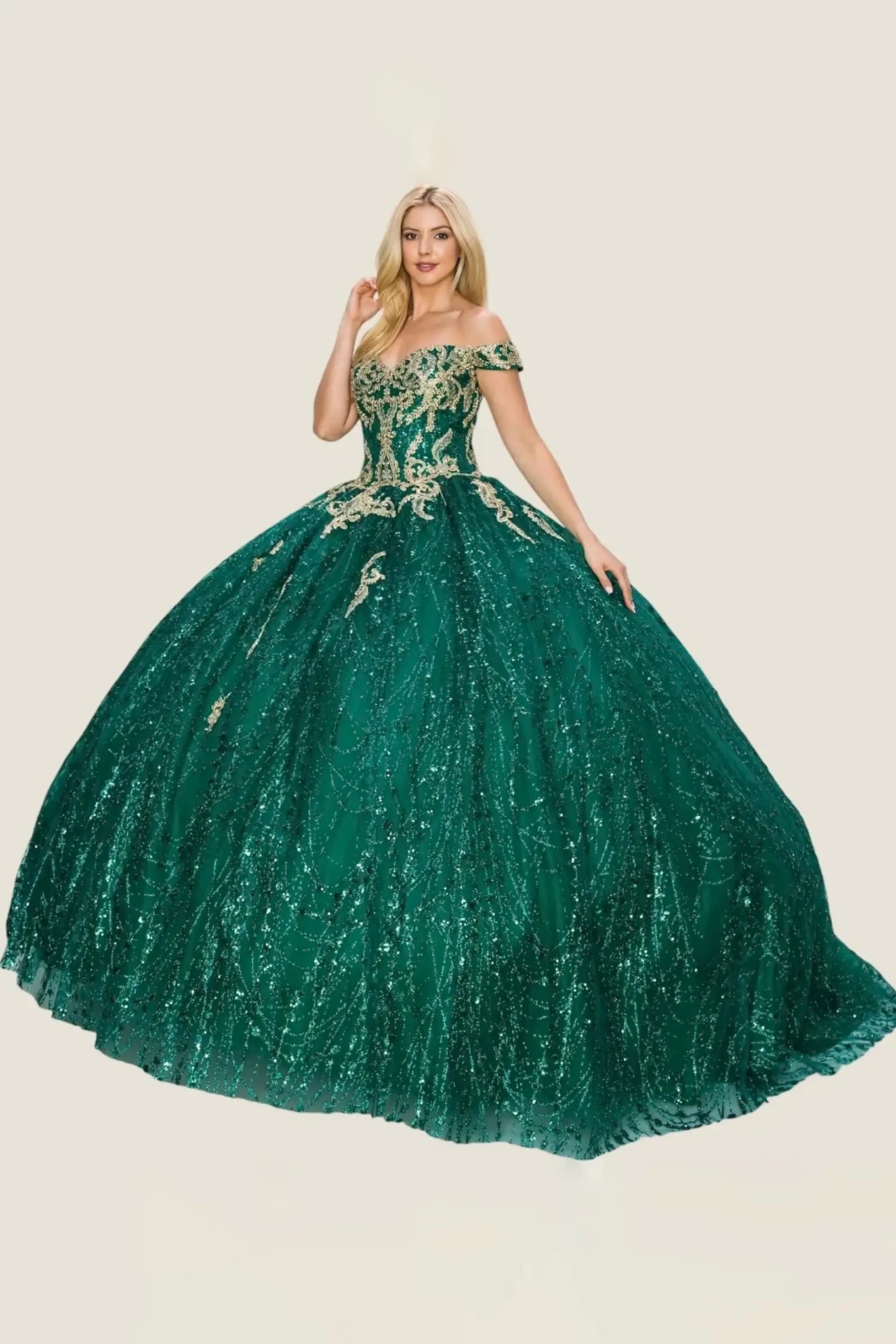Green sequin gown with floral embellishments on a beige background
